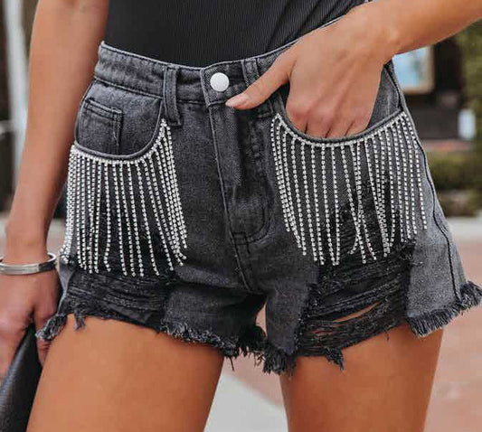 Abbigliamento donna Arrivo Pantaloncini di jeans da strada strappati con nappa a catena casual