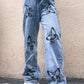 Jeans a gamba dritta drappeggiati con stampa a farfalla dimagranti da donna